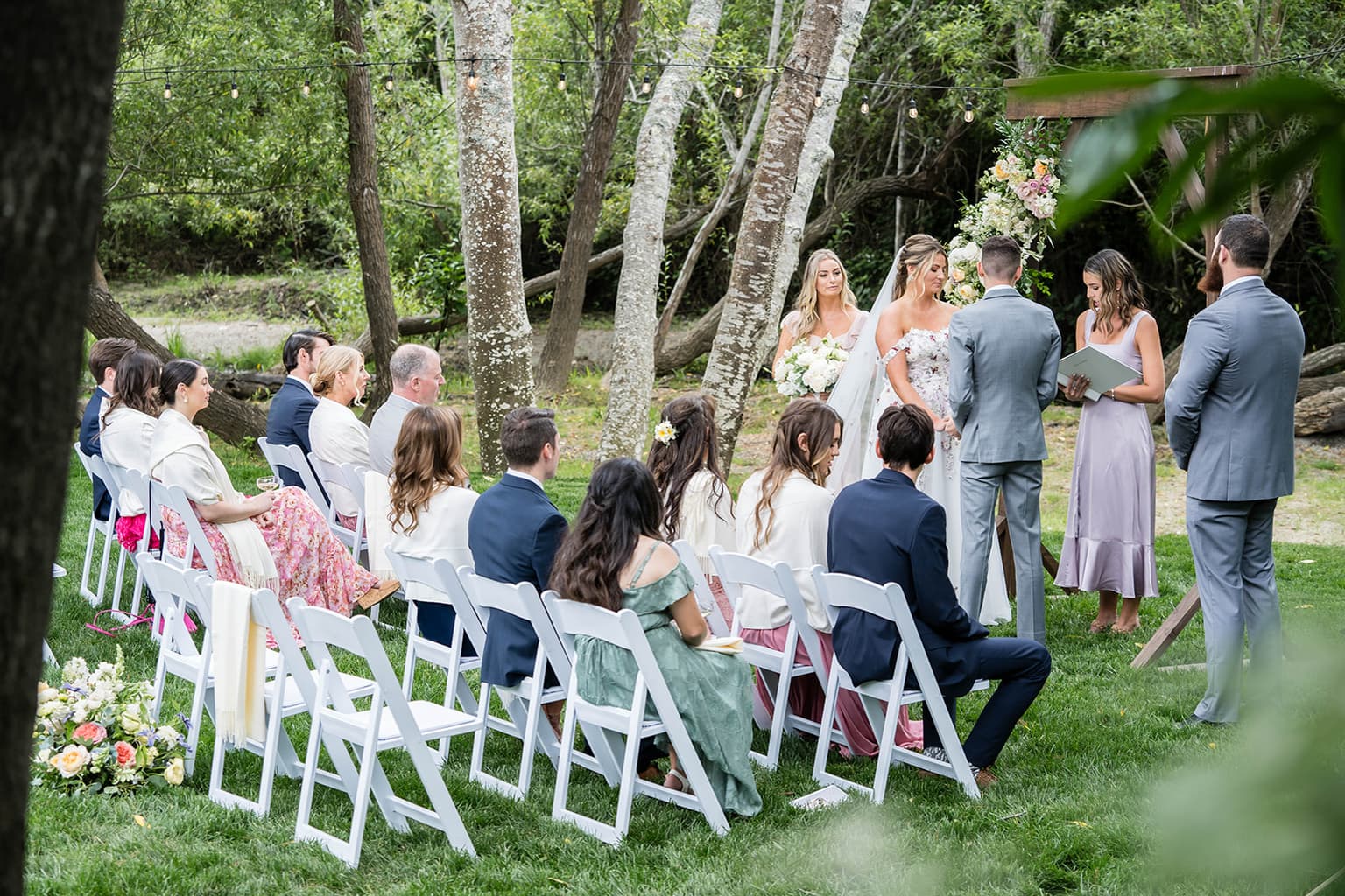 Couple exchanging vows at wine country wedding