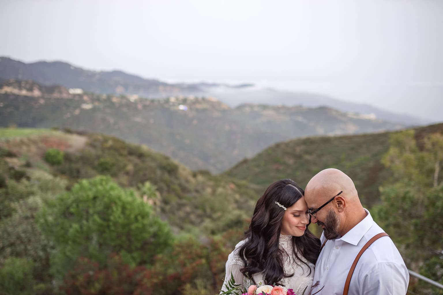 Couple with mountain views at their intimate wedding