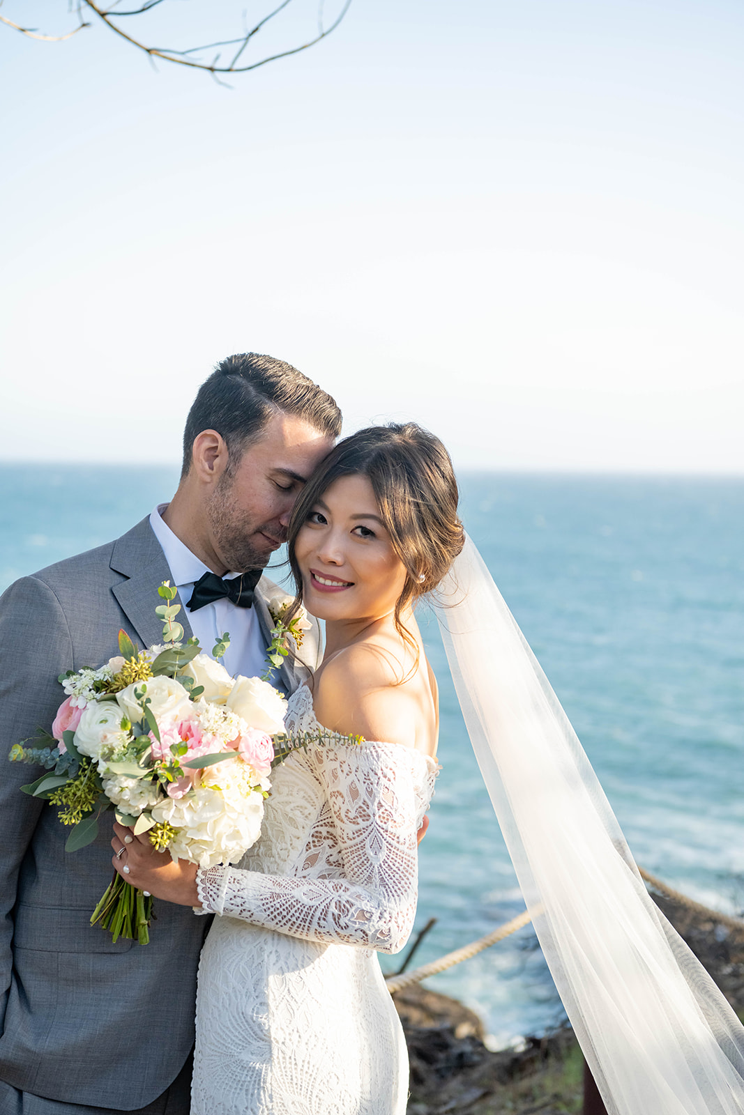 Couple with bouquet on the Mendocino coast