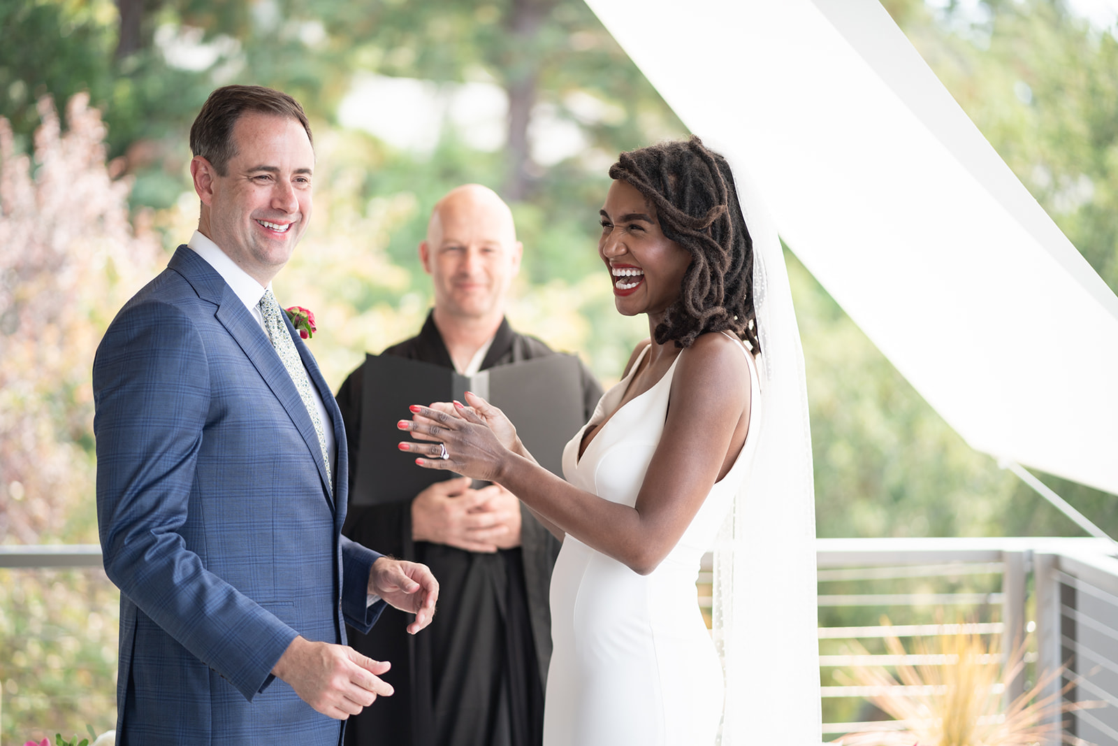Joyful couple at ceremony — laughter and love